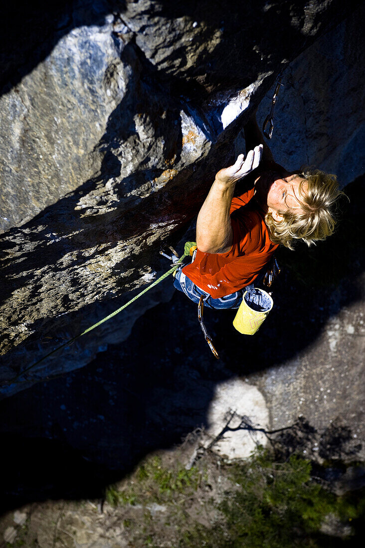 A man climbing up a rock face, Oetztal, Tyrol, Austria