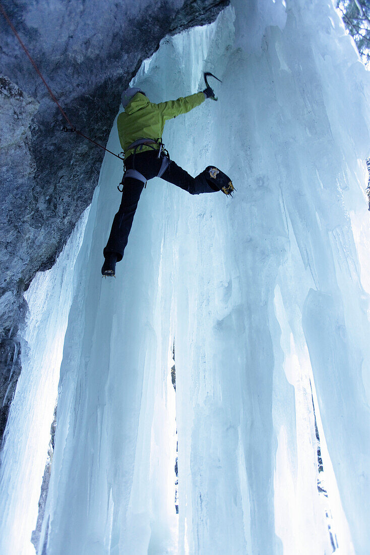 Iceclimber climbing on an ice face, Immenstadt, Bavaria, Germany