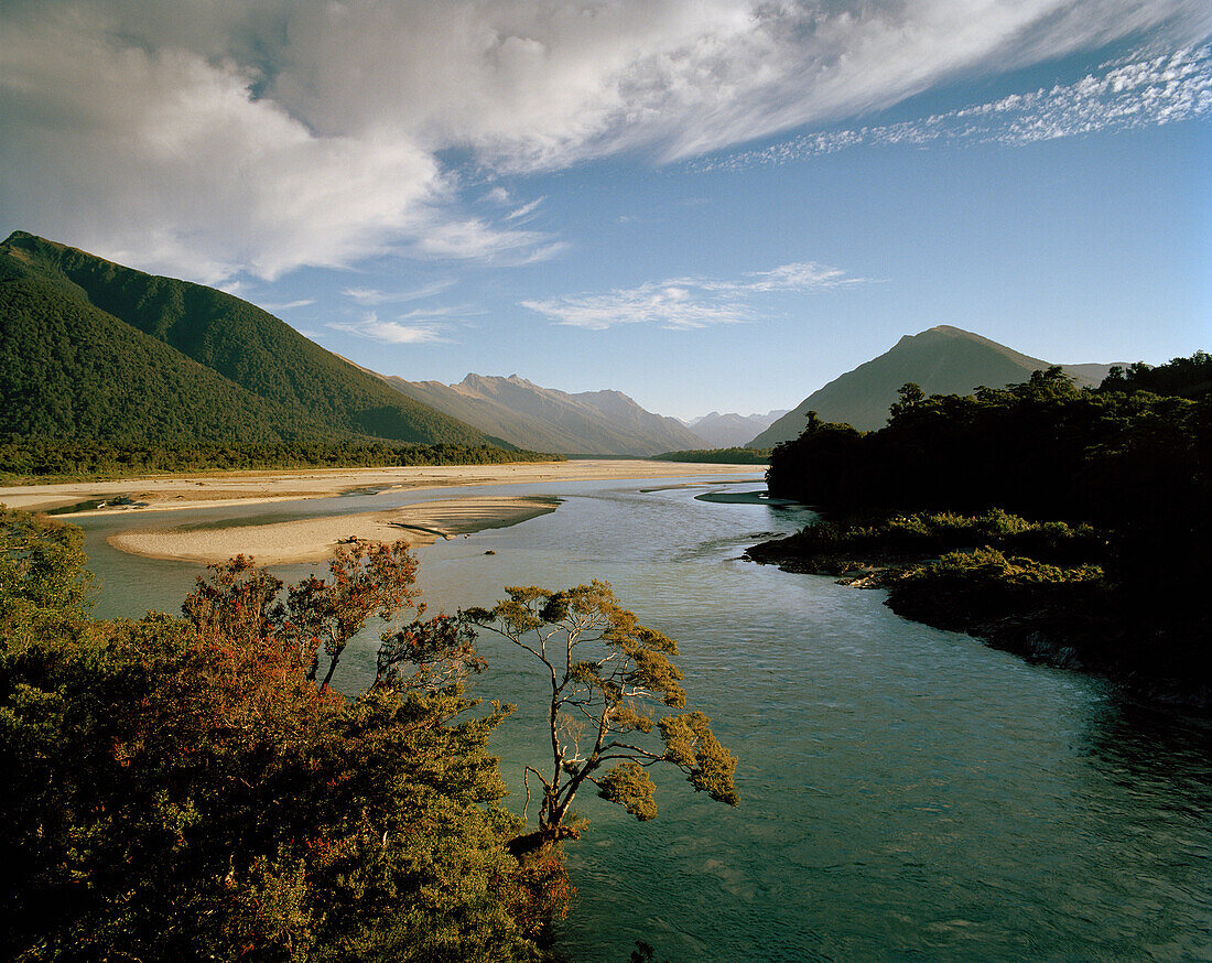 Arawata River and Southern Alps under clouded sky, West Coast, South Island, New Zealand