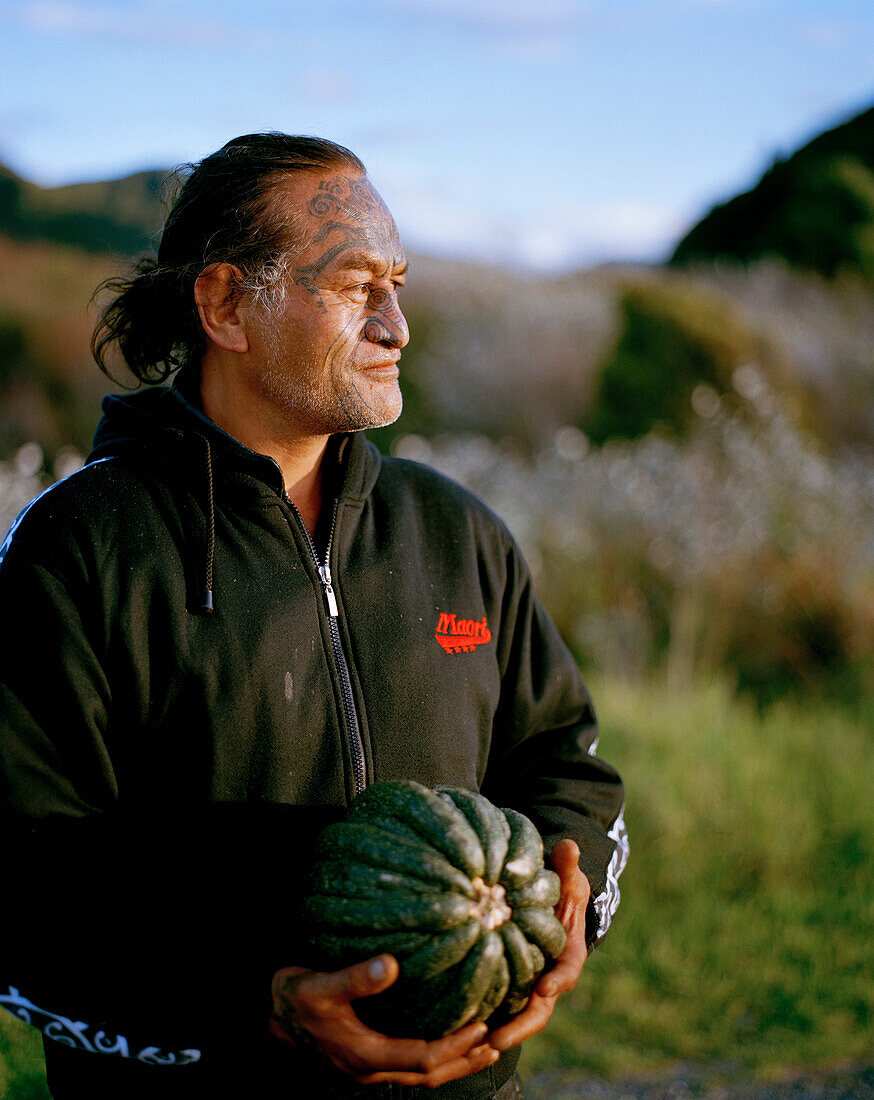 Mature Maori man with facial tatoo, Te Araroa, Eastcape, North Island, New Zealand
