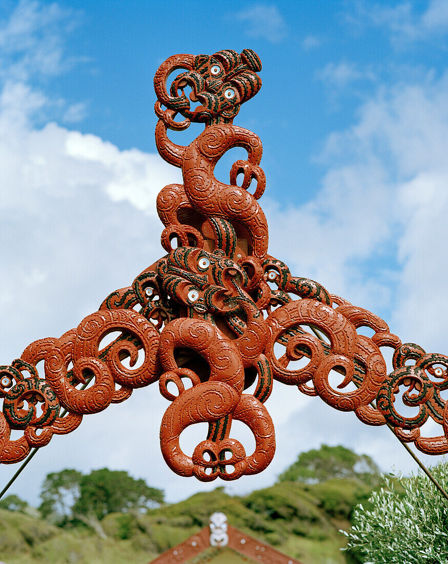 Traditional Maori wood carvings at the entrance of Marae Papatea, North coast, Eastcape, North Island, New Zealand