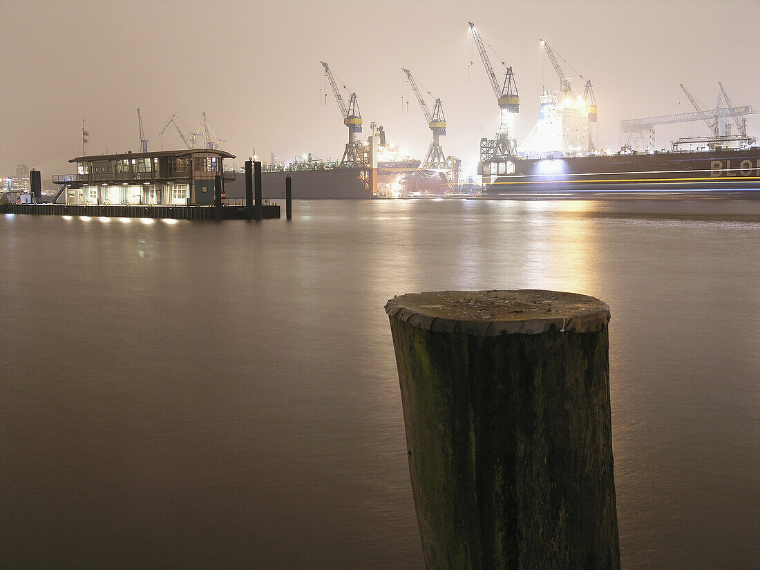 View over river Elbe to dockyard, Hamburg, Germany