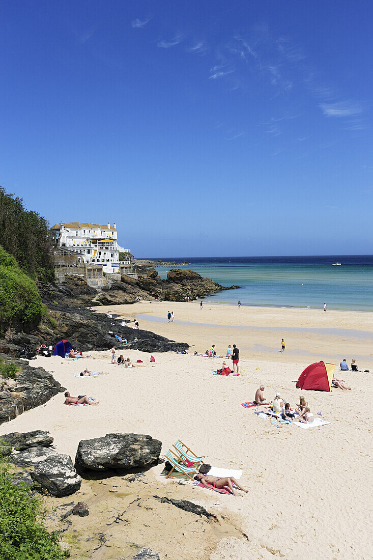 People sunbathing at Porthminster Beach, St. Ives, Cornwall, England, United Kingdom