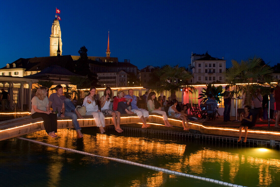 Switzerland Zurich, bare foot bar at river Limmat at night. background Grossmunster