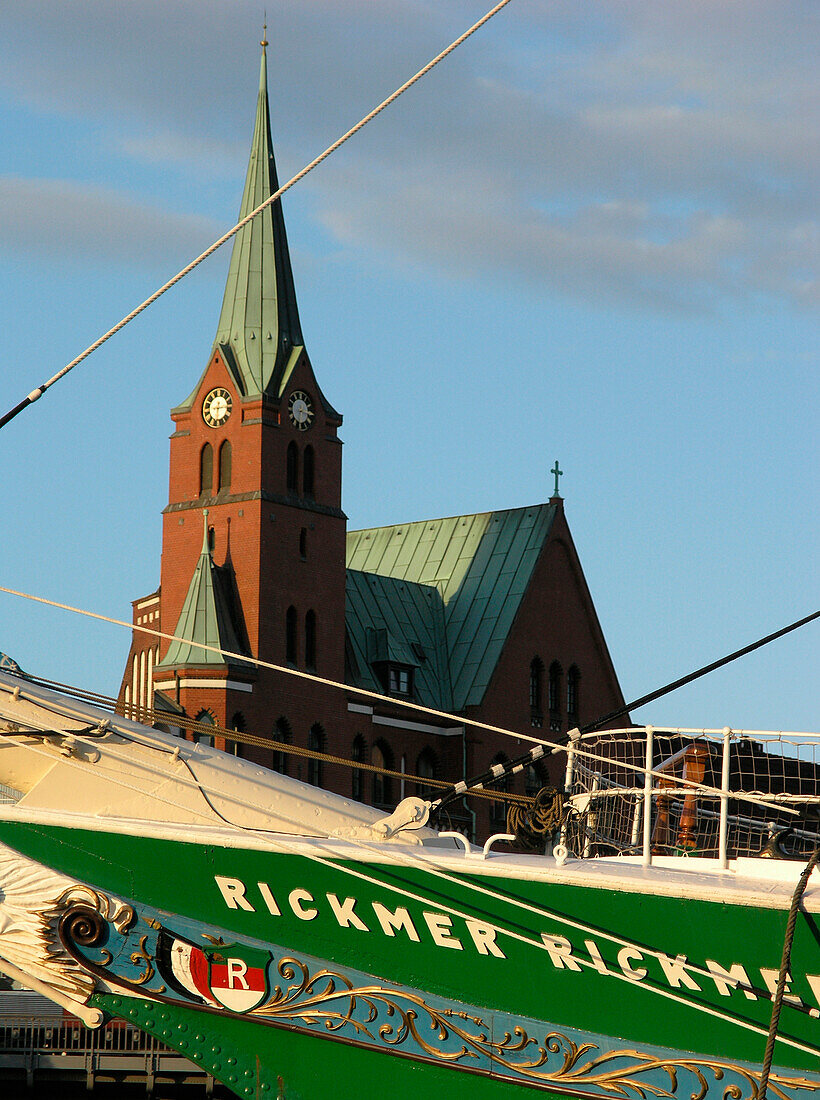 Bow of the Museum Ship Rickmer Rickmers in front of a church, Hanseatic City of Hamburg, Germany