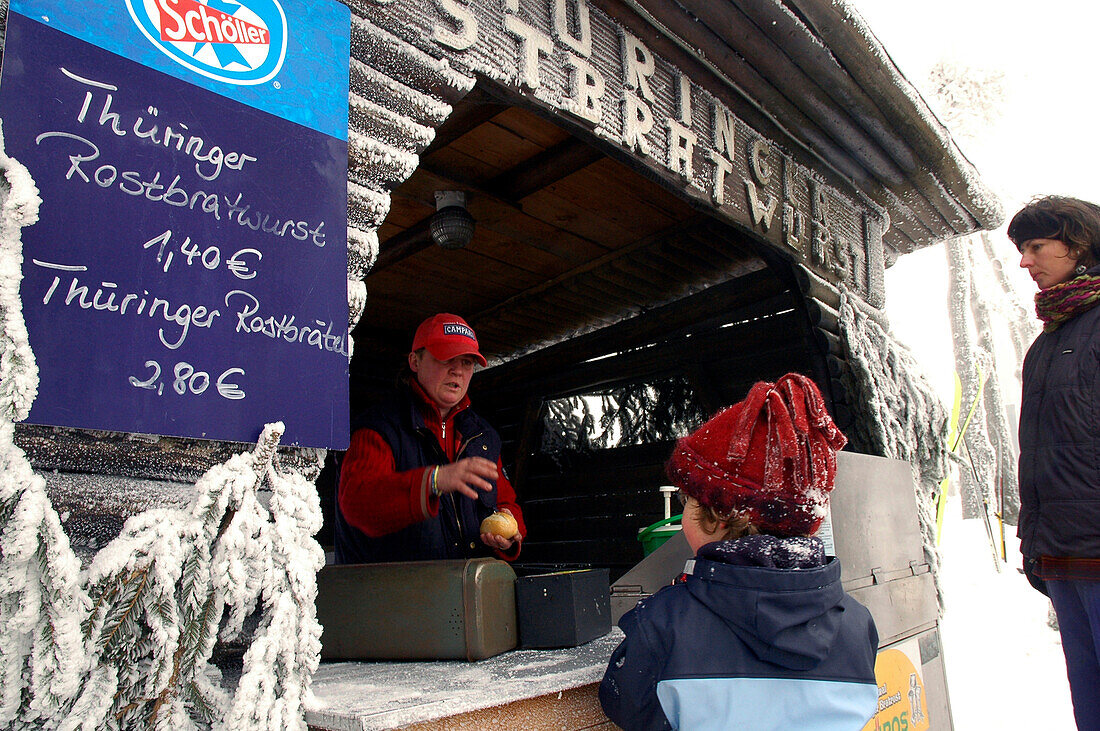 Girl buying Thüringer Bratwurst, Inselberg, Brotterode, Thuringian Forest, Thuringia, Germany