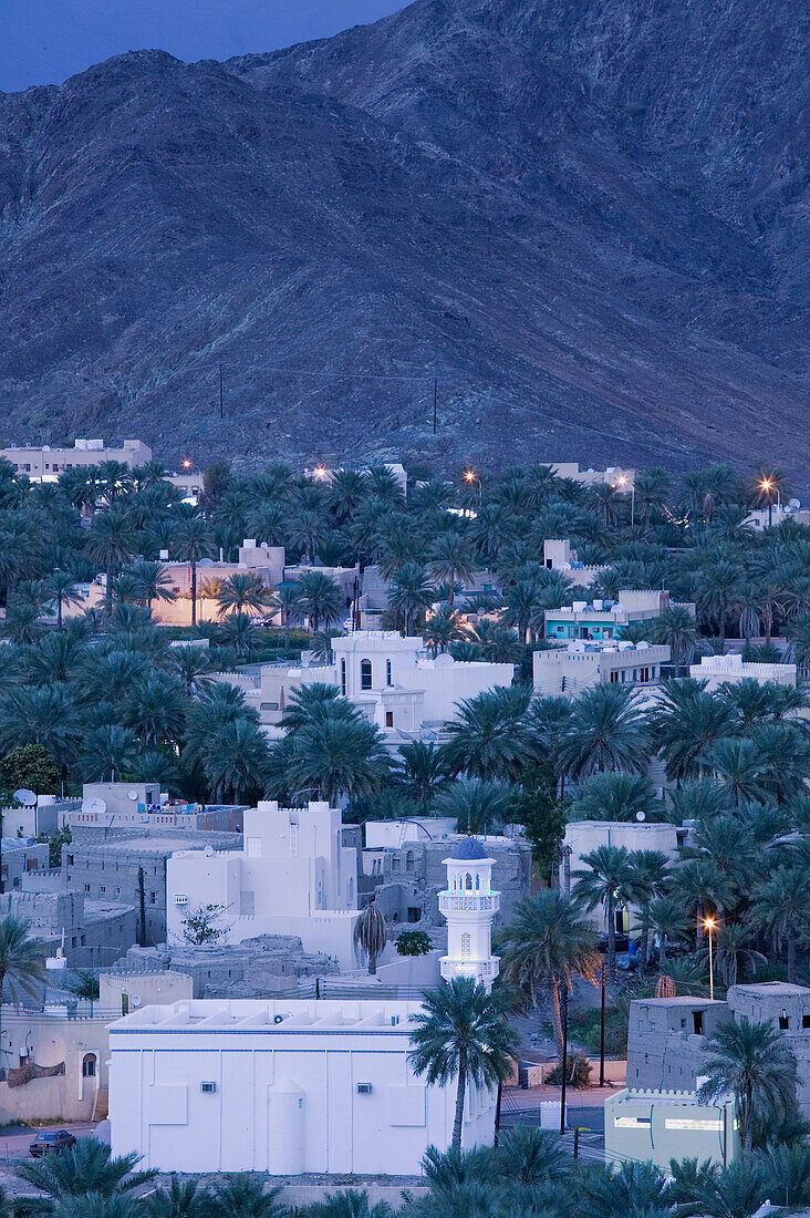 OMAN-Western Hajar Mountains-Bahla: Bahla Town and Village Mosque / Dusk
