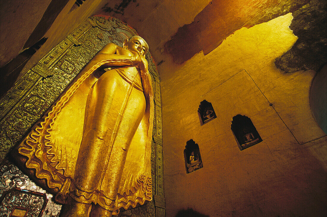 31 feet tall teak hovering Buddha in Ananda Temple, Bagan. Burma