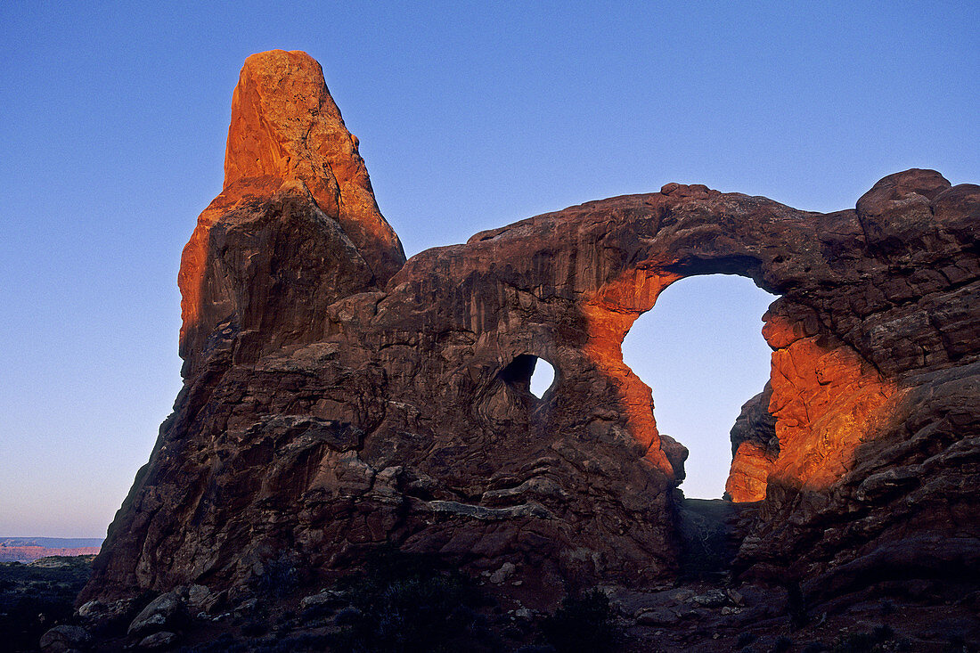 First light on Turret Arch, Windows Section Arches National Park, Utah, USA