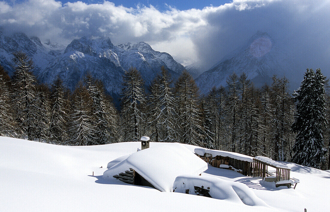 Snowed covered hut in the ski resort of Motta Naluns above Scuol, Lower Engadine, Engadine, Switzerland