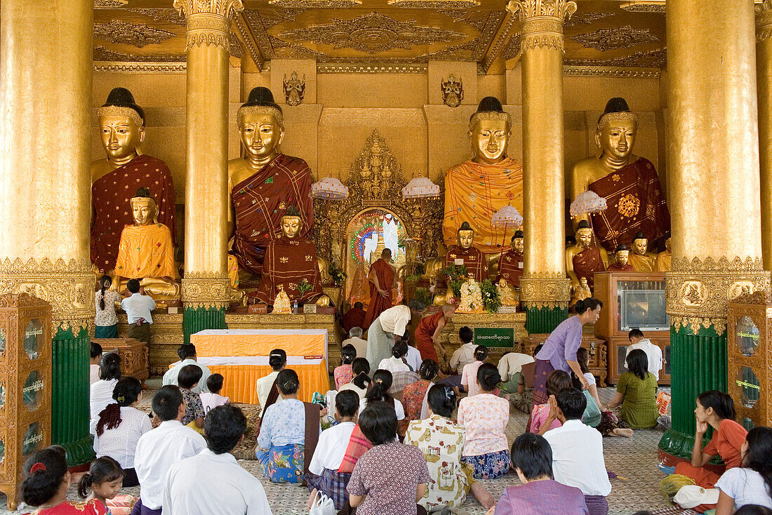 Buddha statues inside the Shwedagon Pagoda at Yangon, Rangoon, Myanmar, Burma