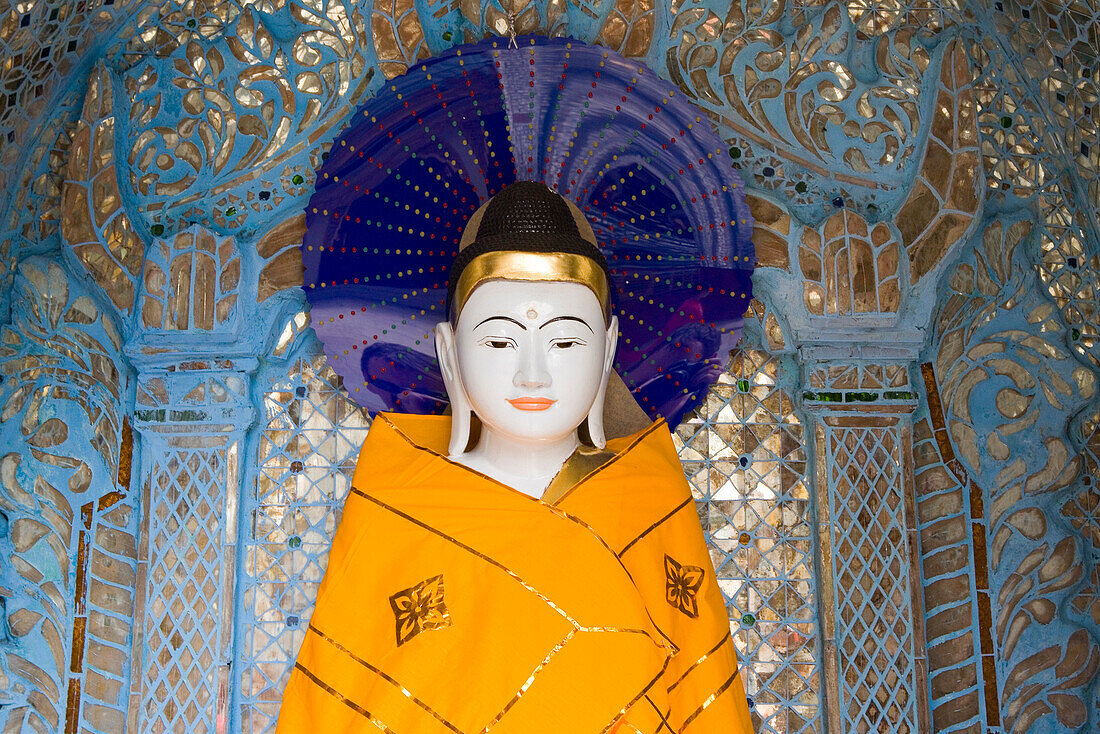Head of a Buddha statue on the grounds of the Shwedagon Pagoda at Yangon, Rangoon, Myanmar, Burma
