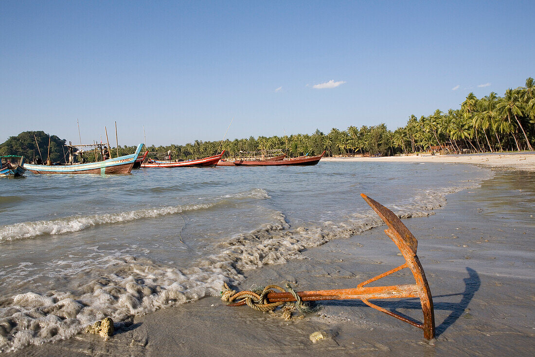 Anchor and fishing boats in Ngapali Beach, Gulf of Bengal, Rakhine State, Myanmar, Burma