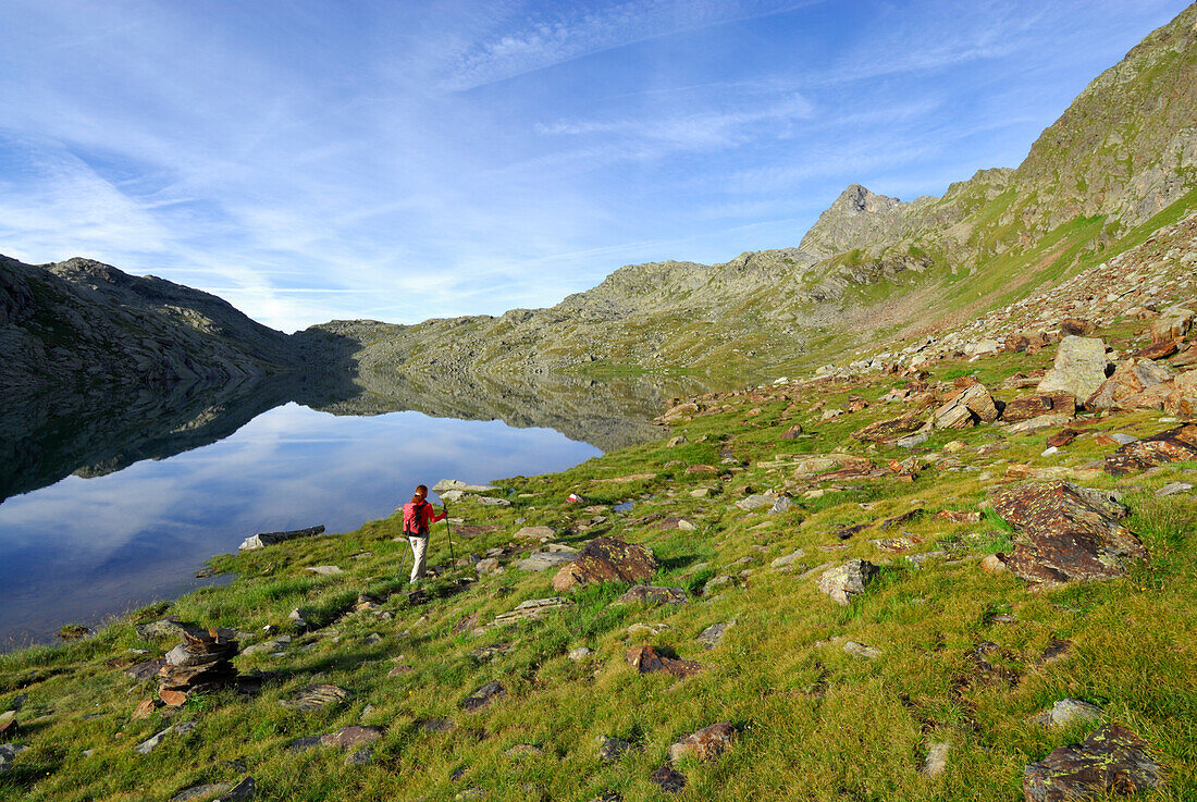 young woman in front of lake Schiefersee, Spronser Joch, Spronser Seenplatte, Texelgruppe range, Ötztal range, South Tyrol, Italy