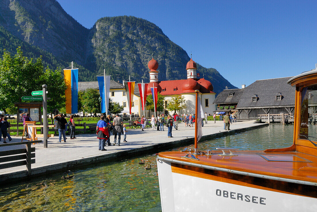 people walking on pier, with boat, St. Bartholomä, lake Königssee, Berchtesgaden range, National Park Berchtesgaden, Berchtesgaden, Upper Bavaria, Bavaria, Germany