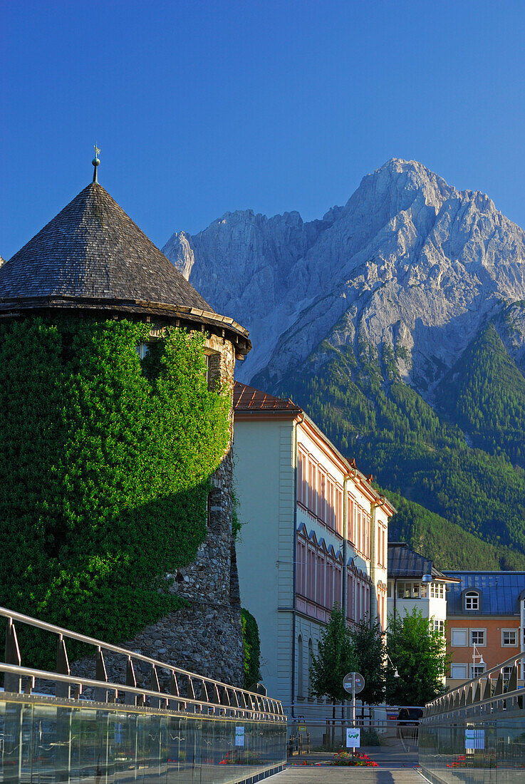 tower Iselturm from bridge Iselsteg with scenery of Lienzer Dolomites range, city of Lienz, East Tyrol, Austria