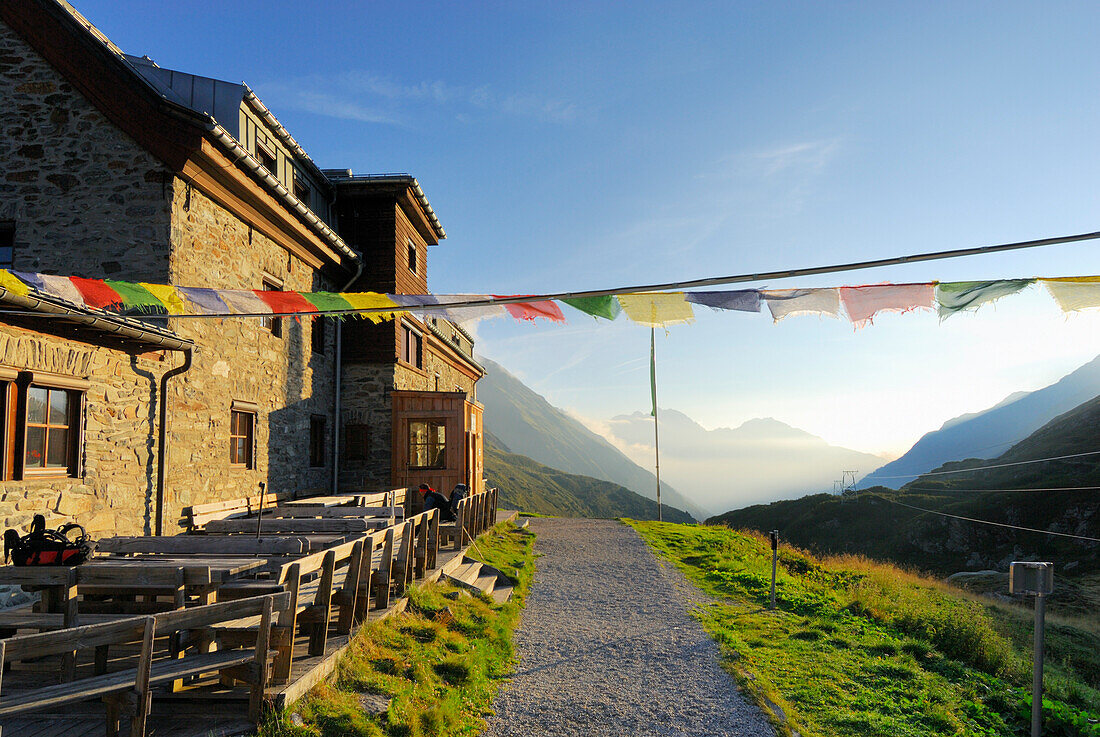 hut Franz-Senn-Huette with prayer flags, Stubaier Alpen range, Stubai, Tyrol, Austria