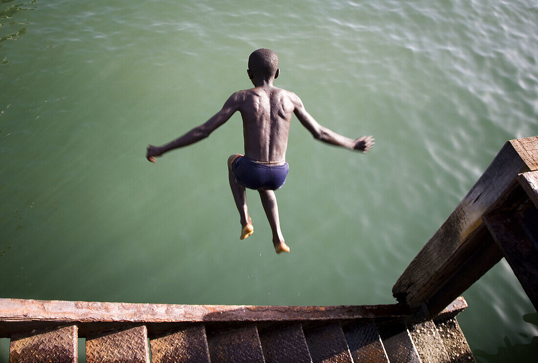 Boy diving. Gambia