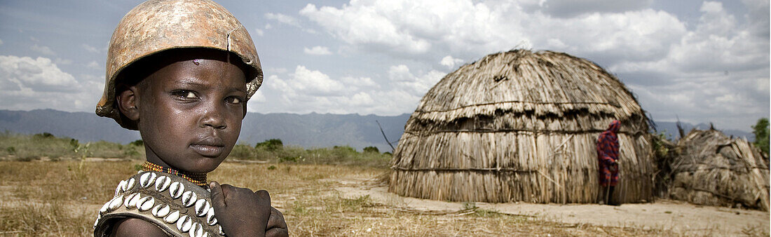 Arbore boy and hut. South Ethiopia