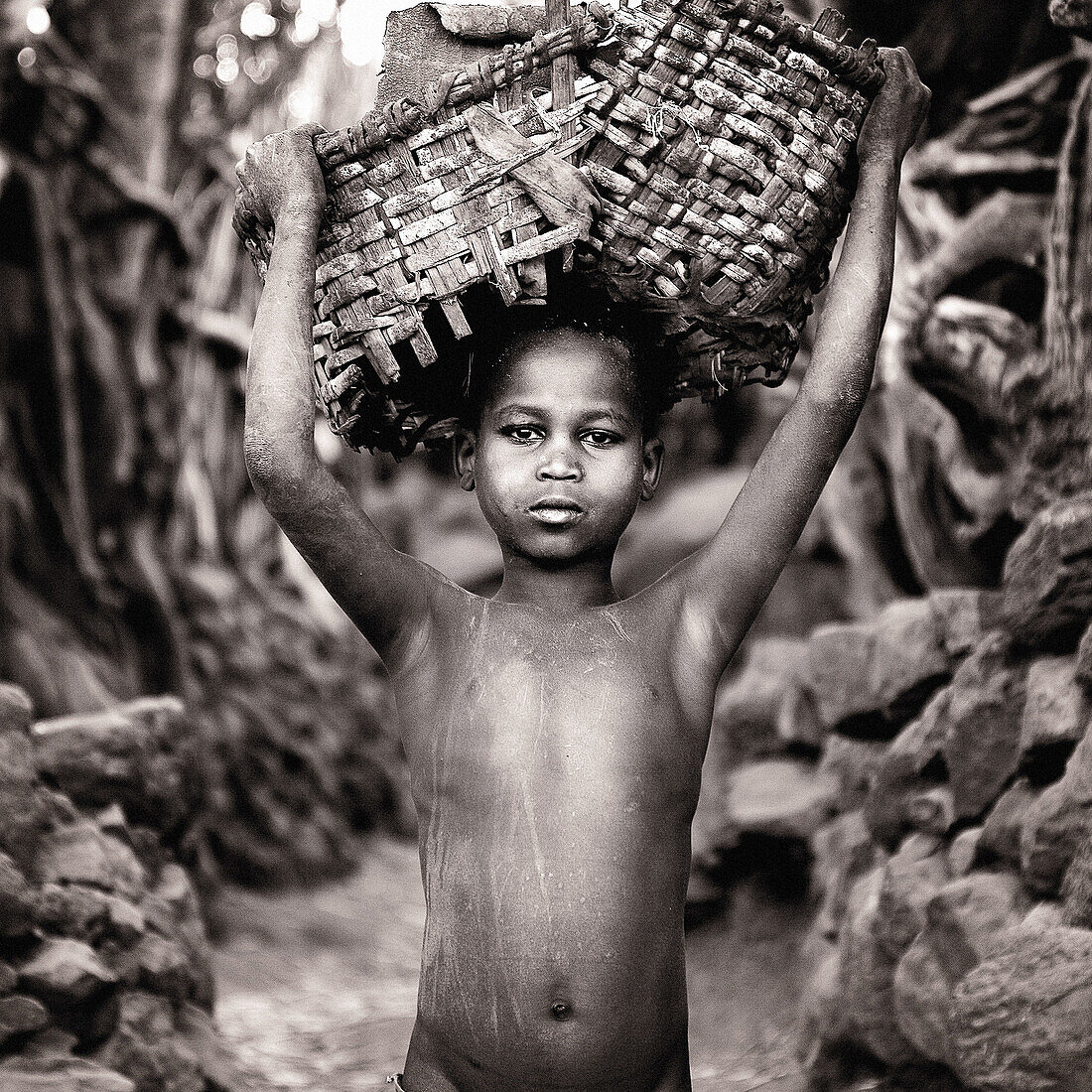 Konso boy carrying basket. South Ethiopia. African people