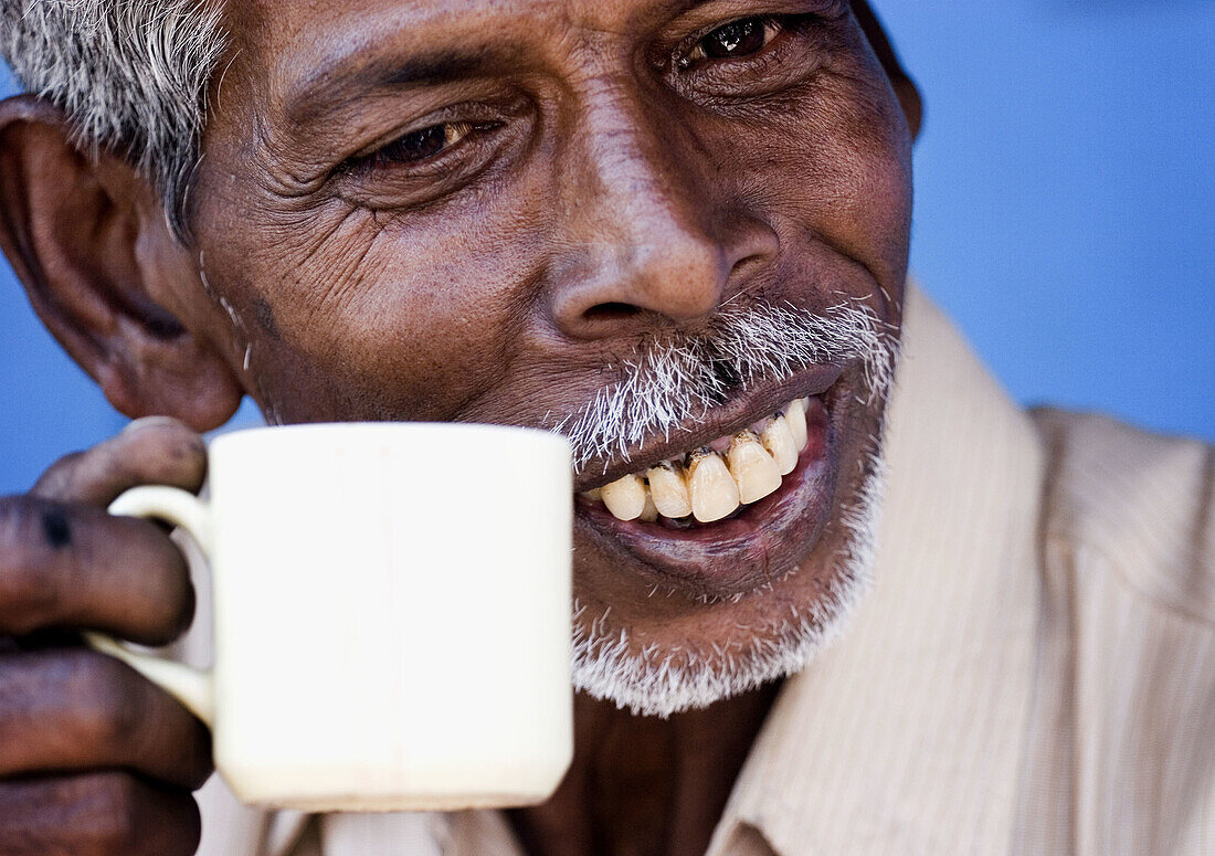 Man drinking tea, Agra. Uttar Pradesh, India