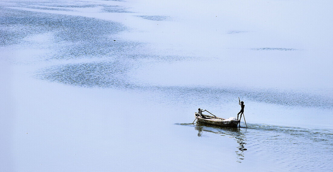 Boys rowing boat, Allahabad. Uttar Pradesh, India