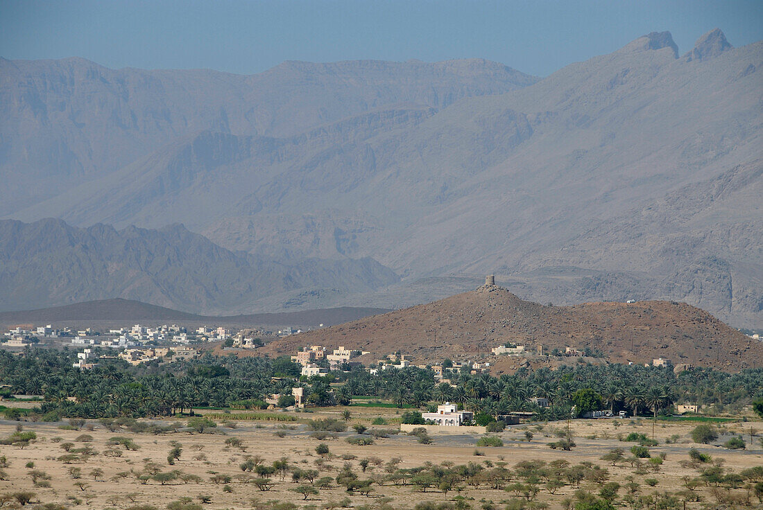 Houses in a distance in front of mountains, Al Hajar  mountains, Oman, Asia, Oman, Asia