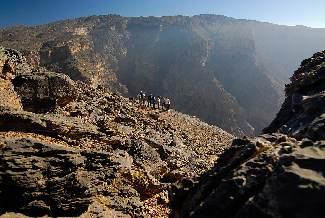 People looking at view at Al Hajar mountains, Oman, Asia