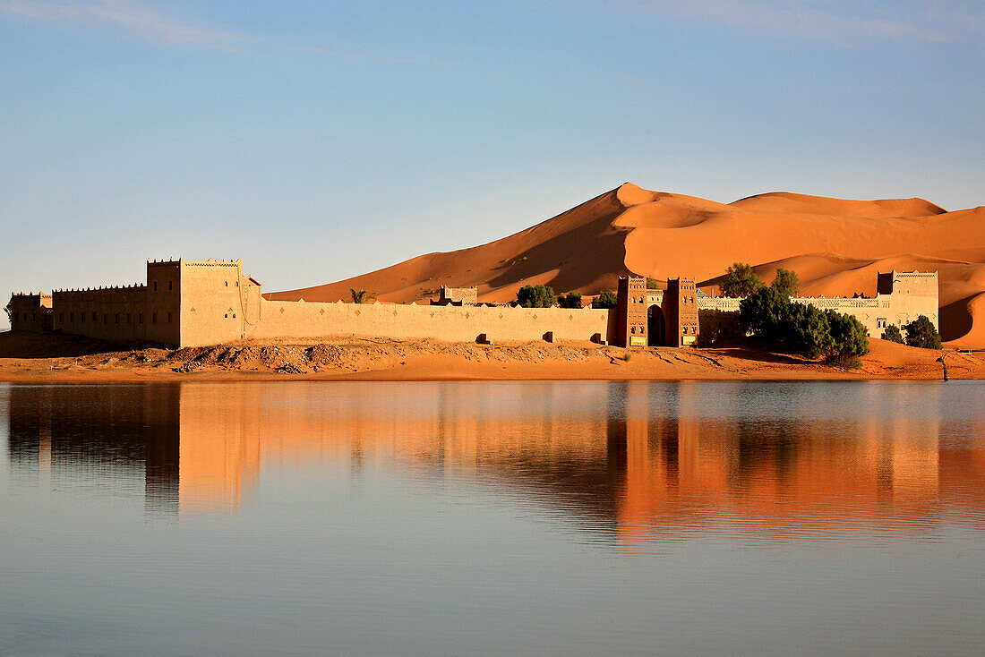 Auberge Yasmina at a lake in front of the dunes of Erg Chebbi desert, Morocco, Africa