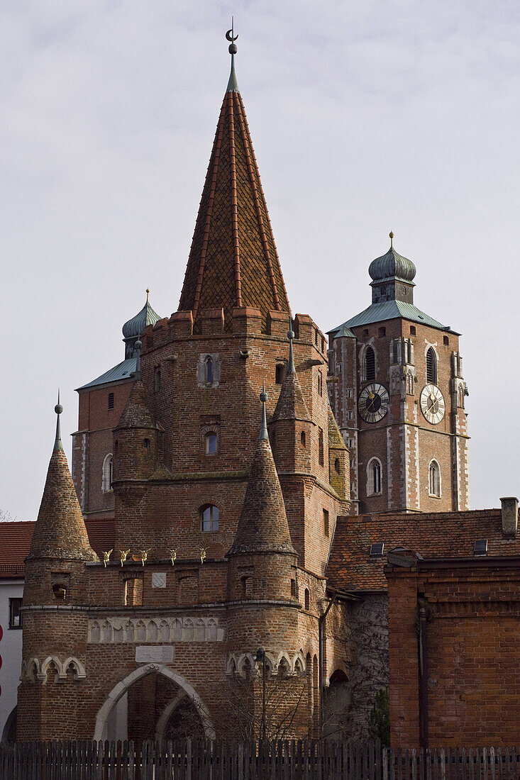 Kreuztor, one of the still existing gates from the old city wall, Church in the background, Ingolstadt, Bavaria, Germany