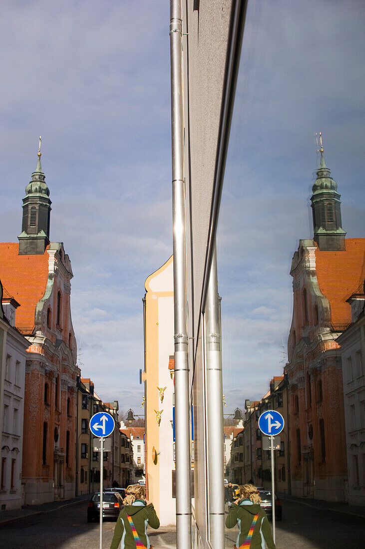 Reflection of the Asam church in a glass window, Ingolstadt, Bavaria, Germany