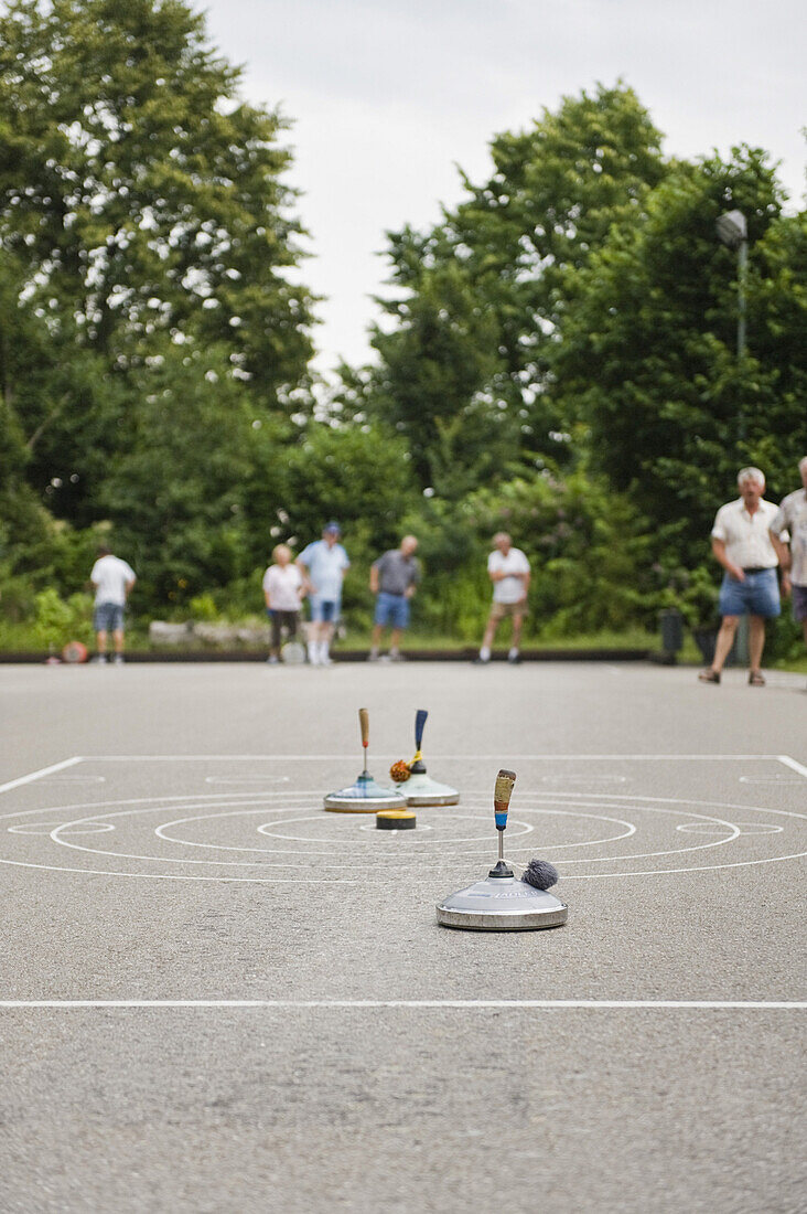 A small group of pensioners playing stock sport, Leisure activity, Park, Oberhaching, Bavaria, Germany