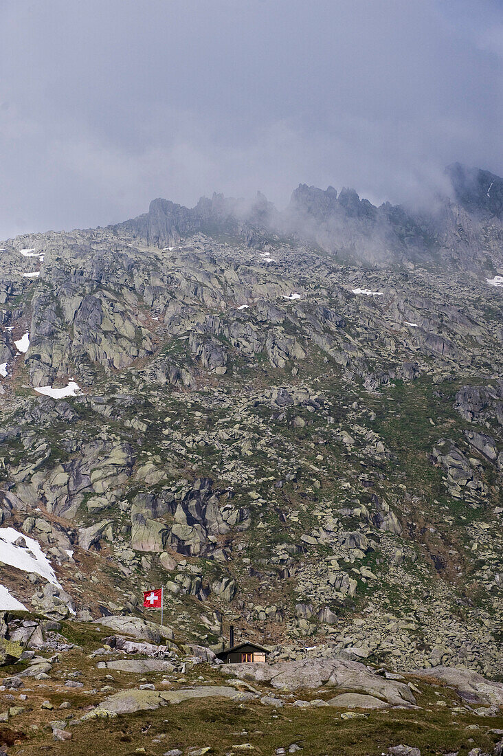 Mountain hut in a mountain landscape, Swiss Flag, Canton Uri, Switzerland