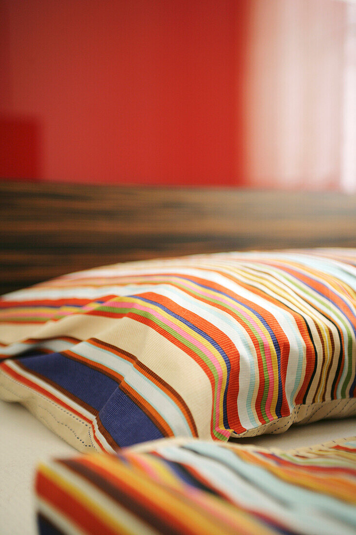 Pillows with stripes in sleeping room