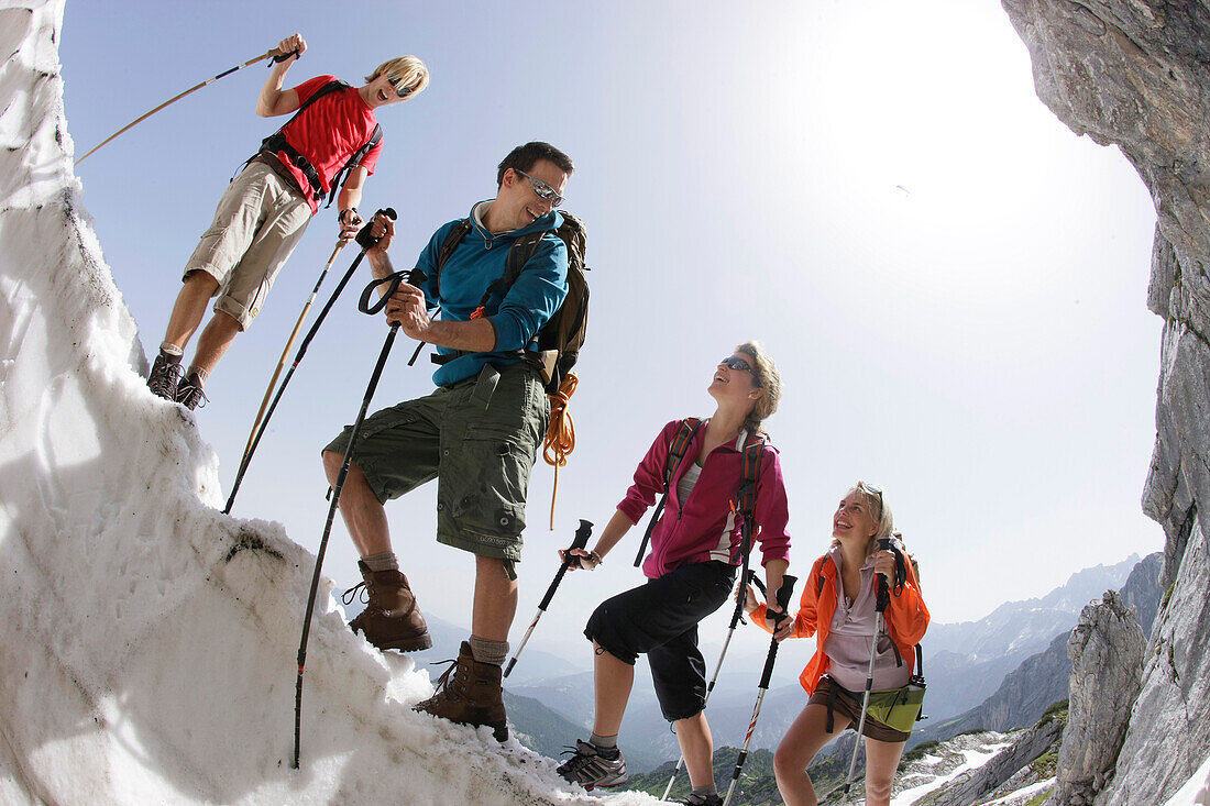 Hikers on cornice, Werdenfelser Land, Bavaria, Germany