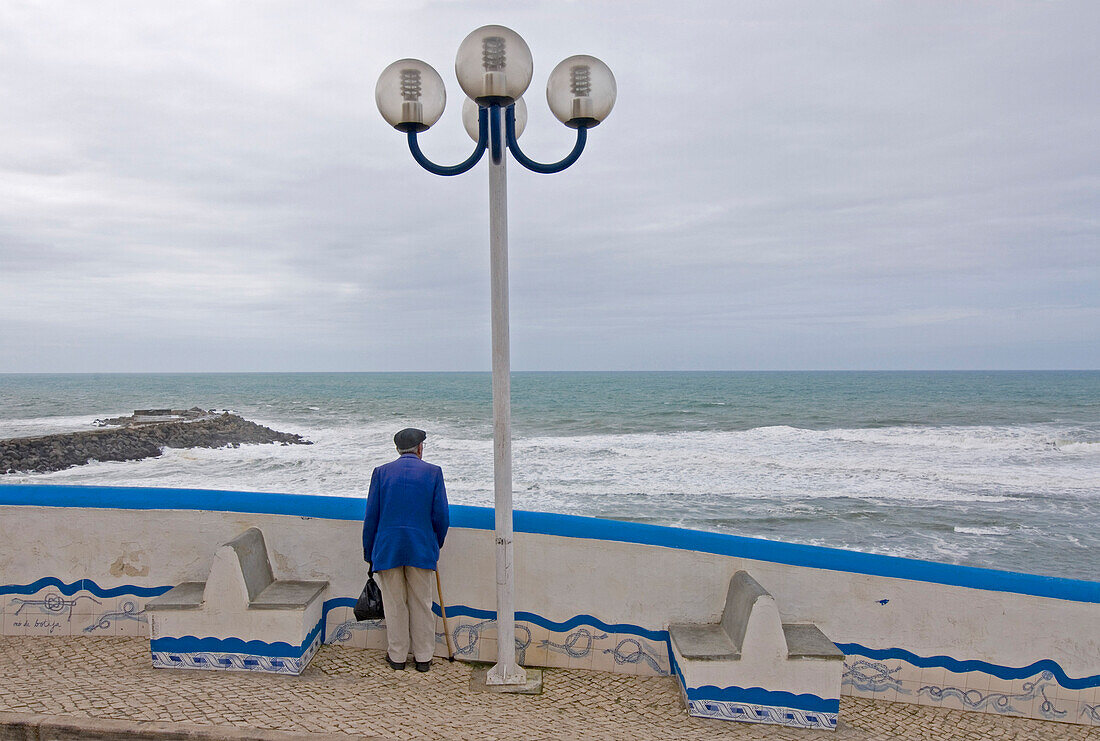 Old man, pensioner looking out to sea, Historical, old fishing village, Ericeira, Portugal, Atlantic