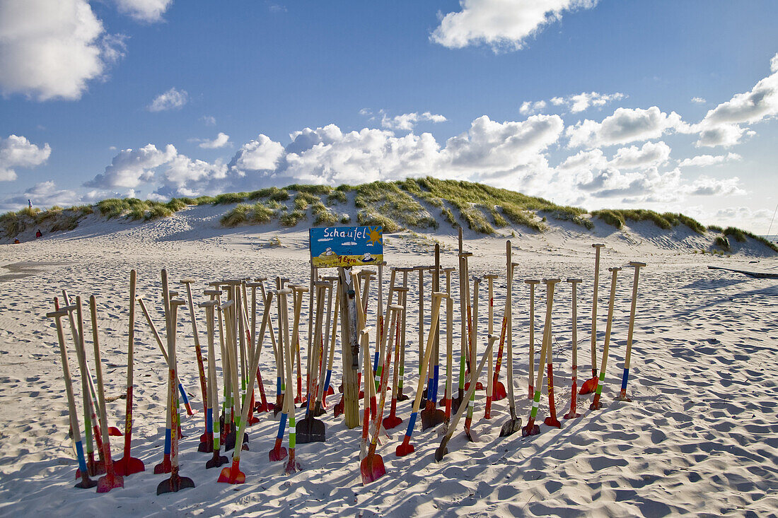 Children's shovels at beach, Amrum island, Schleswig-Holstein, Germany