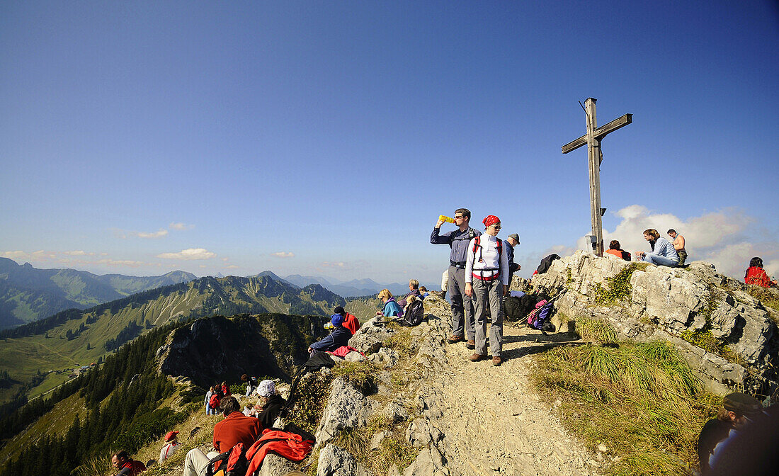People hiking on the Brecherspitz over Schliersee, Bavaria, Germany