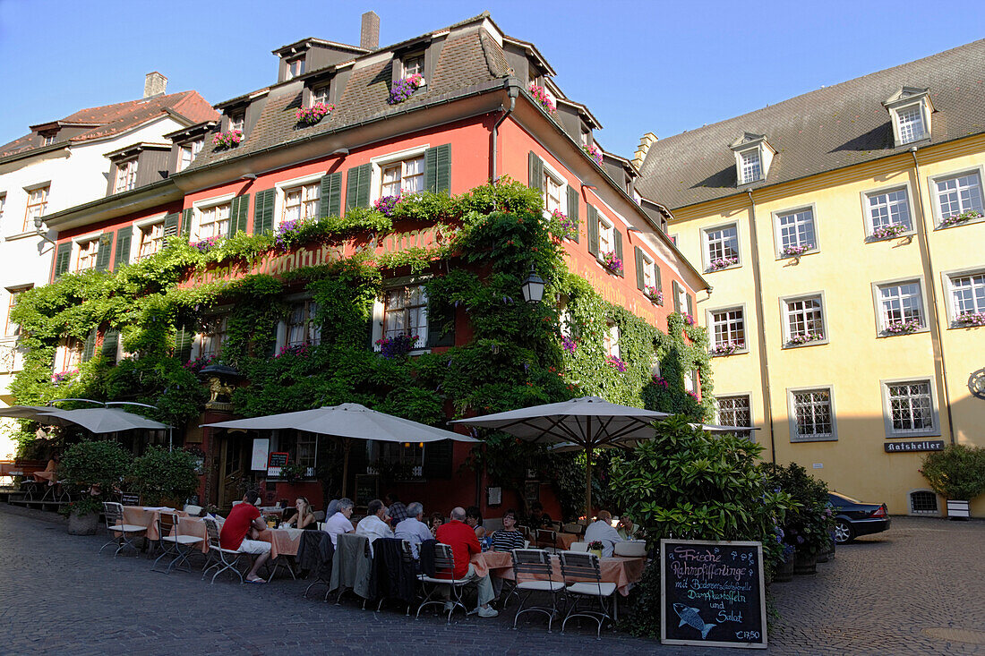 Guests sitting in a sidewalk cafe, Meersburg, Baden-Wurttemberg, Germany