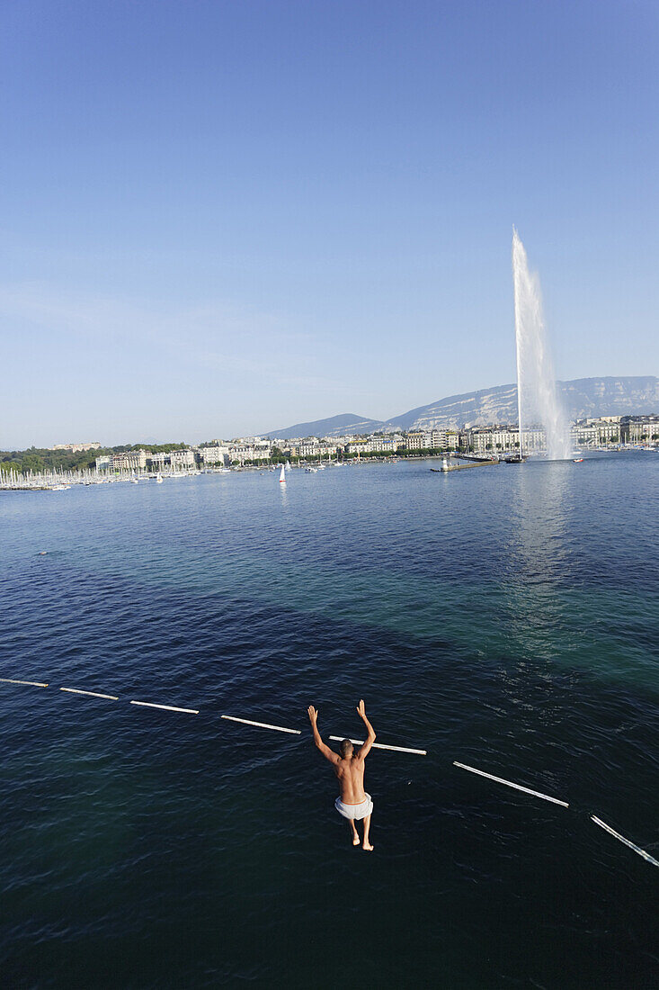 Man jumping from tower into the lake, Bains des Paquis, Geneva, Canton of Geneva, Switzerland