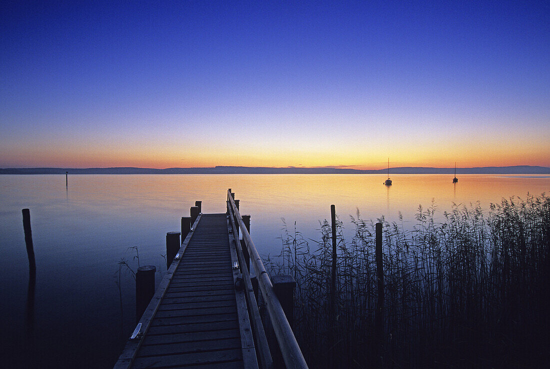 Jetty at the lakeshore at dusk, Lake Constance, Baden Wurttemberg, Germany