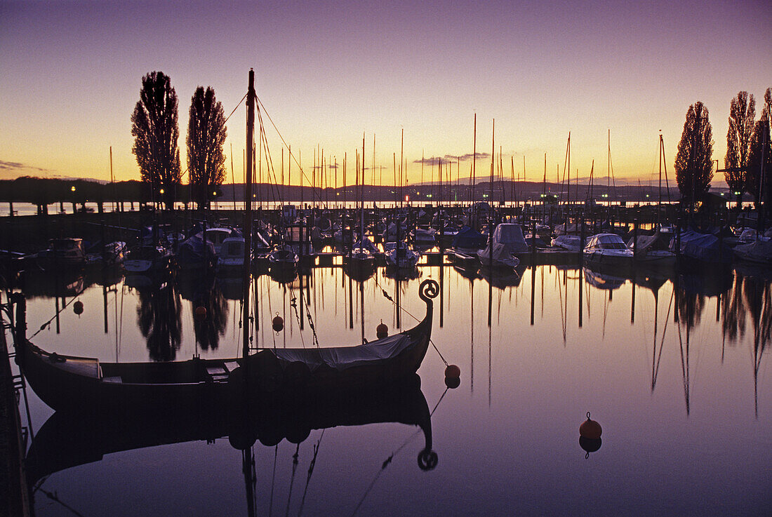 Viking ship at the marina at dusk, Unteruhldingen, Lake Constance, Baden Wurttemberg, Germany