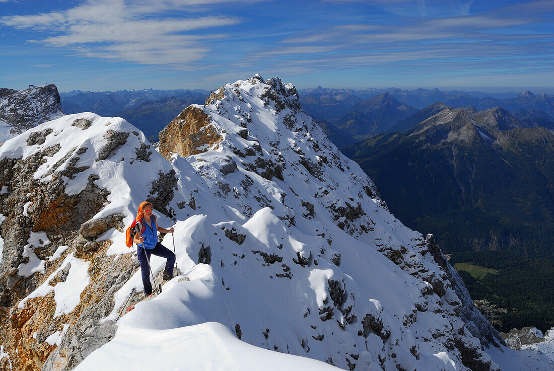 Woman on ridge to summit of Zugspitze, Wetterstein range, Upper Bavaria, Bavaria, Germany