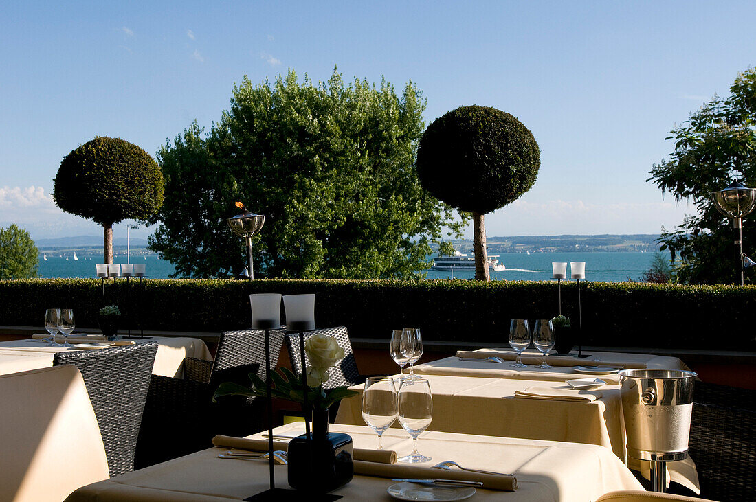 Tables are laid at the terrace with view of the lake at Restaurant Casala, Hotel Residenz am See, Meersburg, Lake Constance, Baden-Wurttemberg, Germany