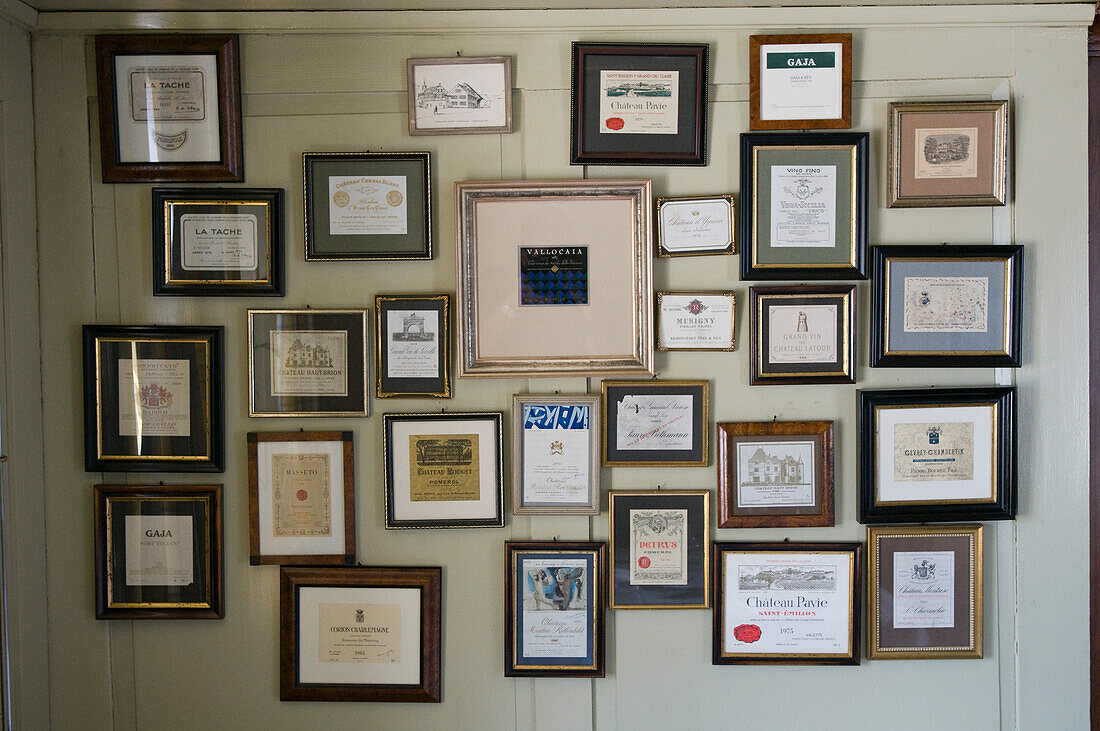 Decoration, photo frames with wine labels hung on the wall, Restaurant Taverne Zum Schäfli, Owner and head chef Wolfgang Kuchler, Wigoltingen, Lake Constance, Switzerland