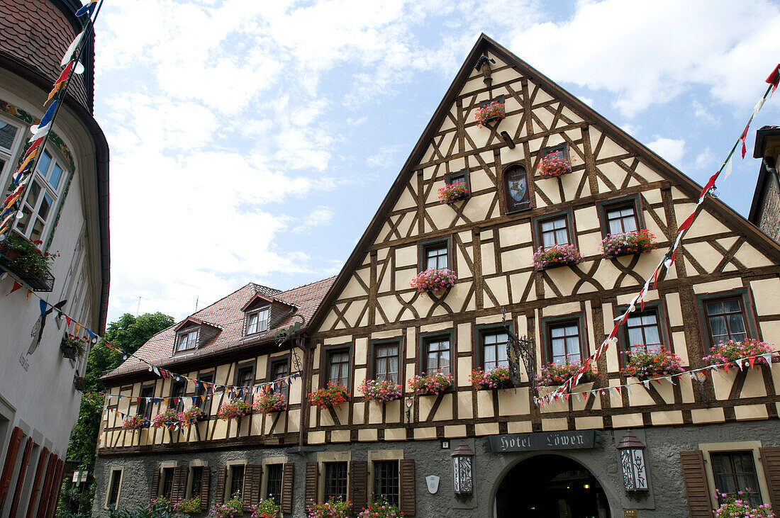 Exterior view of the Hotel and Restaurant Löwen under cloudy sky, Marktbreit, Franconia, Bavaria, Germany