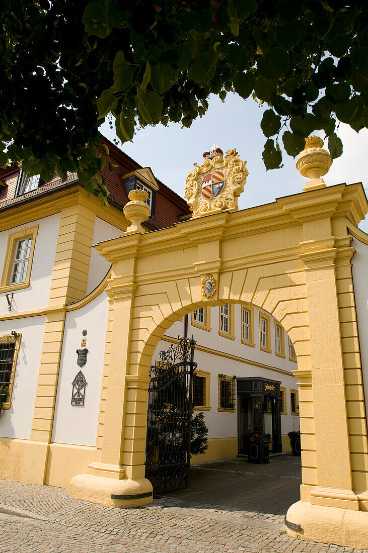Gate with emblem in the sunlight, Hotel Zehntkeller, Iphofen, Franconia, Bavaria, Germany
