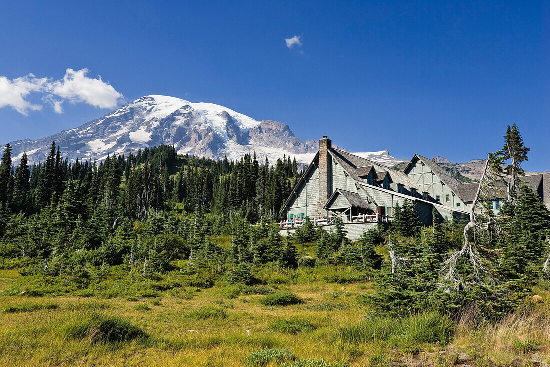 The hotel Paradise Inn and Mount Rainier under blue sky, Washington, USA