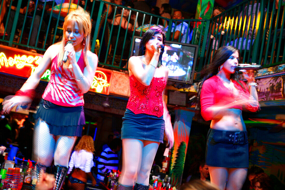 Salsa singers, three women singing at Mango's Nightclub, Ocean Drive, South Beach, Miami Beach, Florida, USA