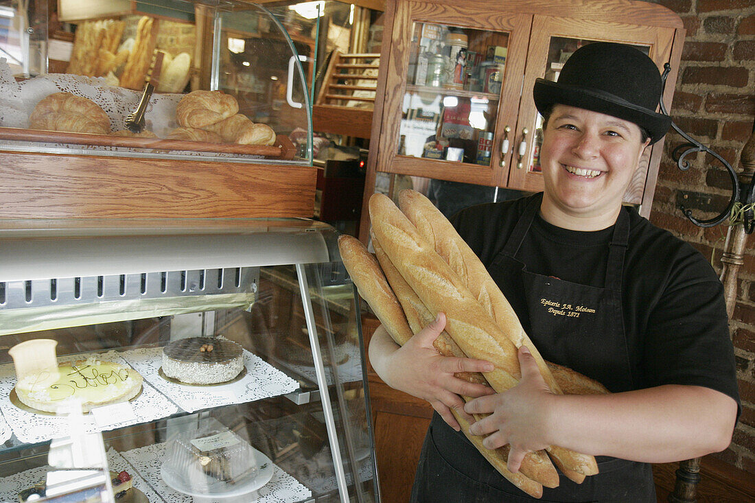 Canada, Quebec City, Rue Saint Jean, J. A. Moisan Grocer, gourmet food, established 1871, female clerk, bread loaves